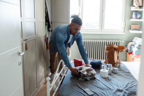 Man packing up items as part of hurricane preparedness for homeowners