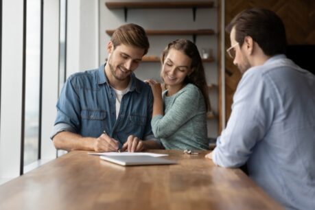 Couple happy to have learned how to make a competitive home offer