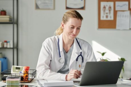 Young woman doctor researching medical professional mortgage student loans