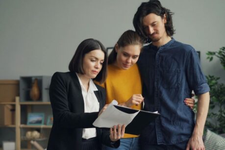 Young couple speaking to loan officer about their mortgage rate lock options