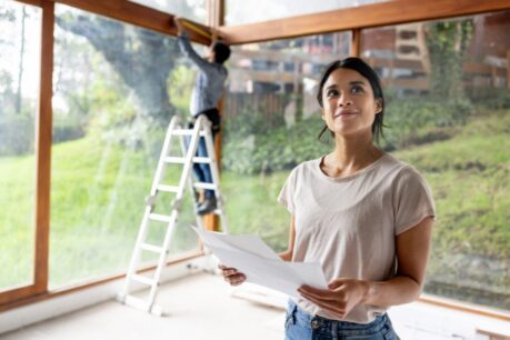 Couple admiring and working on new space after financing a rental property