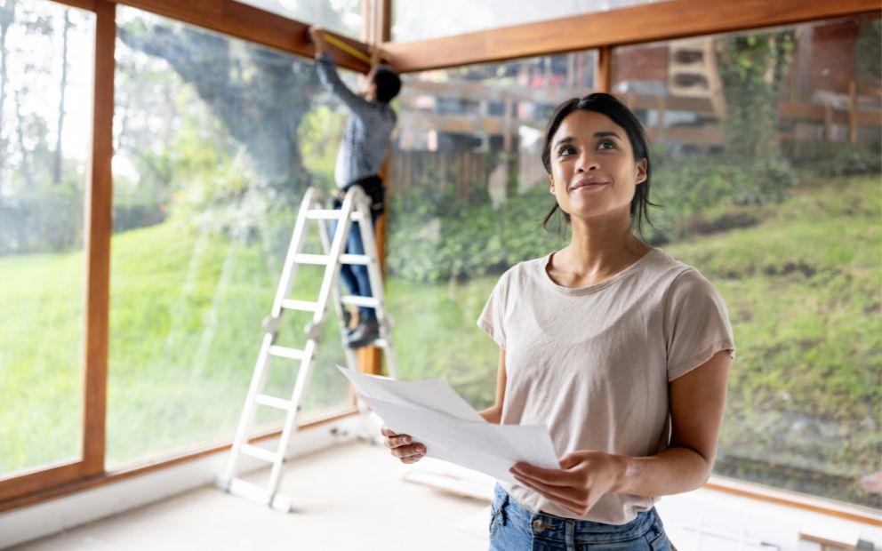 Couple admiring and working on new space after financing a rental property