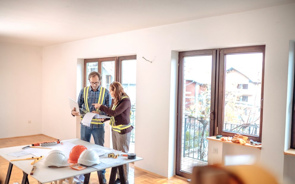 Man and woman discussing what to ask before renovating their home