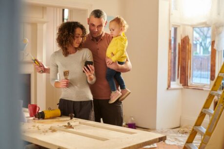 Young family of three enjoying their decision to utilize a FHA 203(k) loan