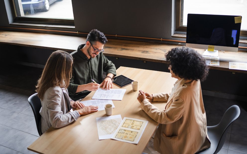 Young woman and man couple learning about the construction draw schedule