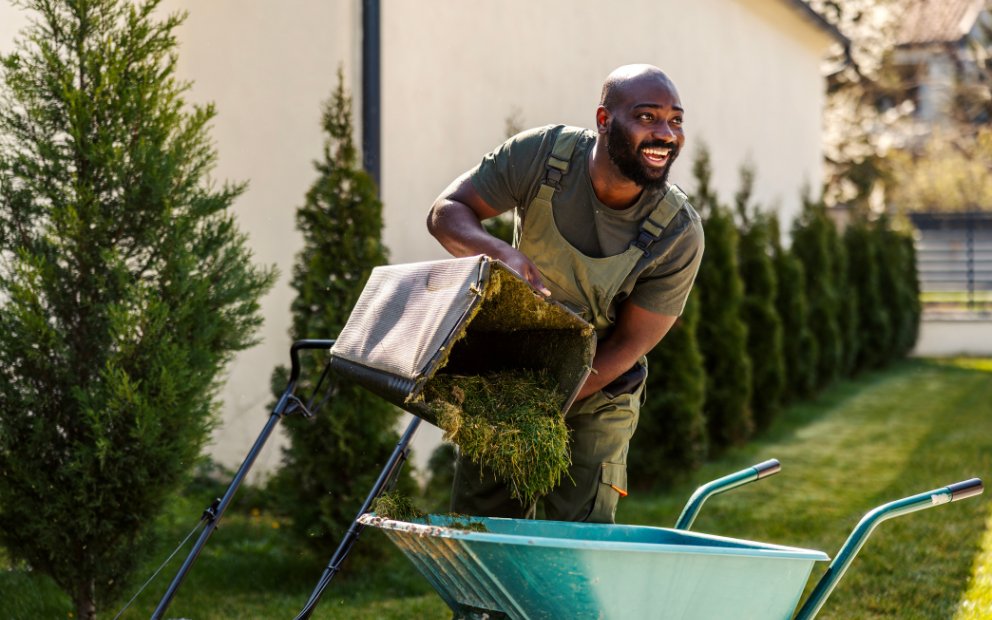 Man working on outdoor project after securing landscaping project financing