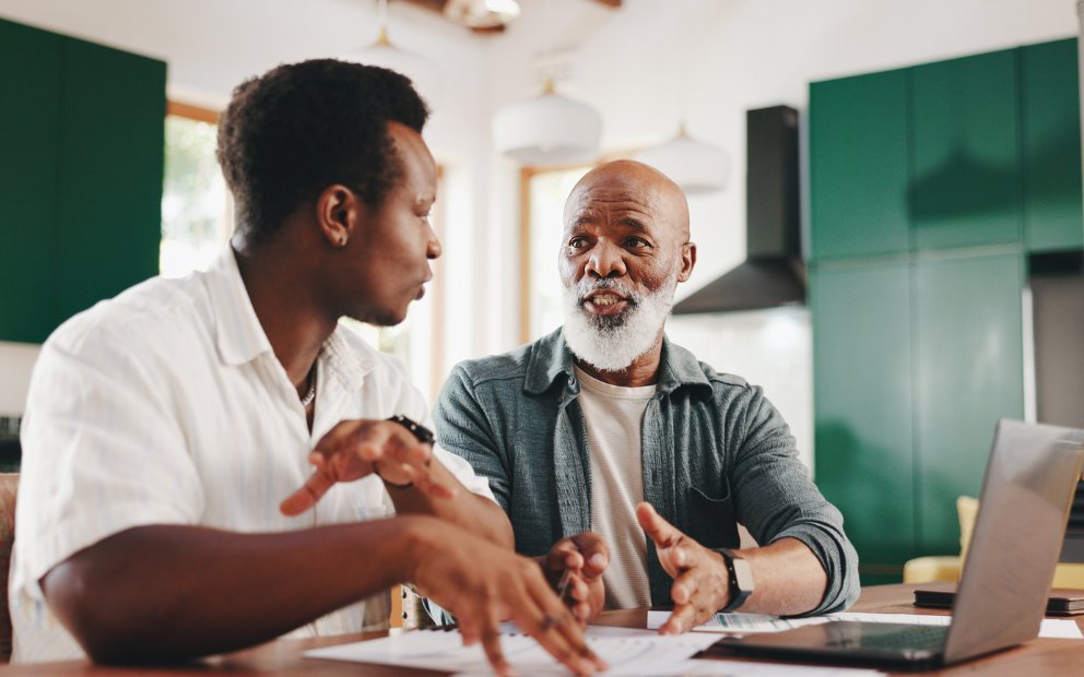 Older man at home asking to his son if you can you use home equity to help your family