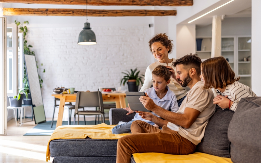 Young family of four enjoying a End of summer home reset