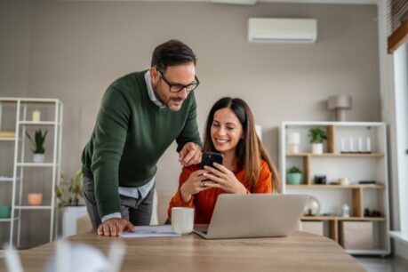 Couple discussing HELOC vs. cash-out refinance