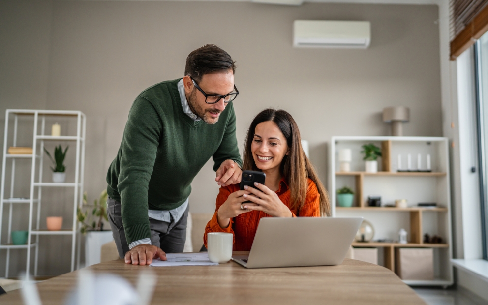 Couple discussing HELOC vs. cash-out refinance