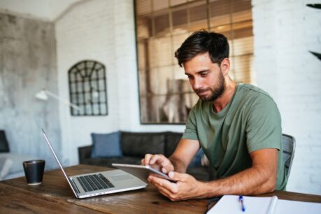 Man comparing features on a high-interest checking account.