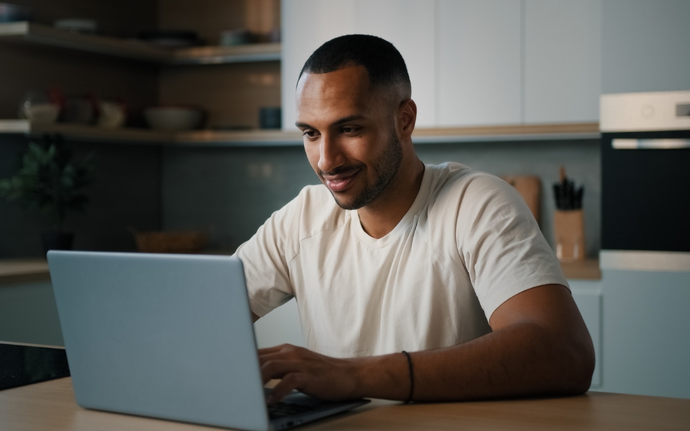Man at home looking into buying a home while stationed overseas