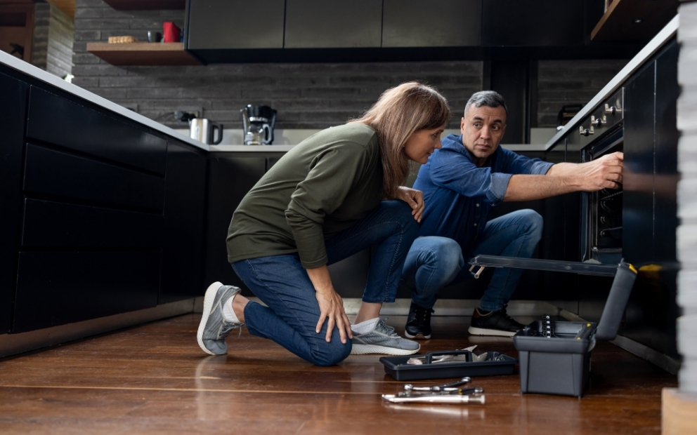 Woman and man homeowners learning the cost of delaying home repairs
